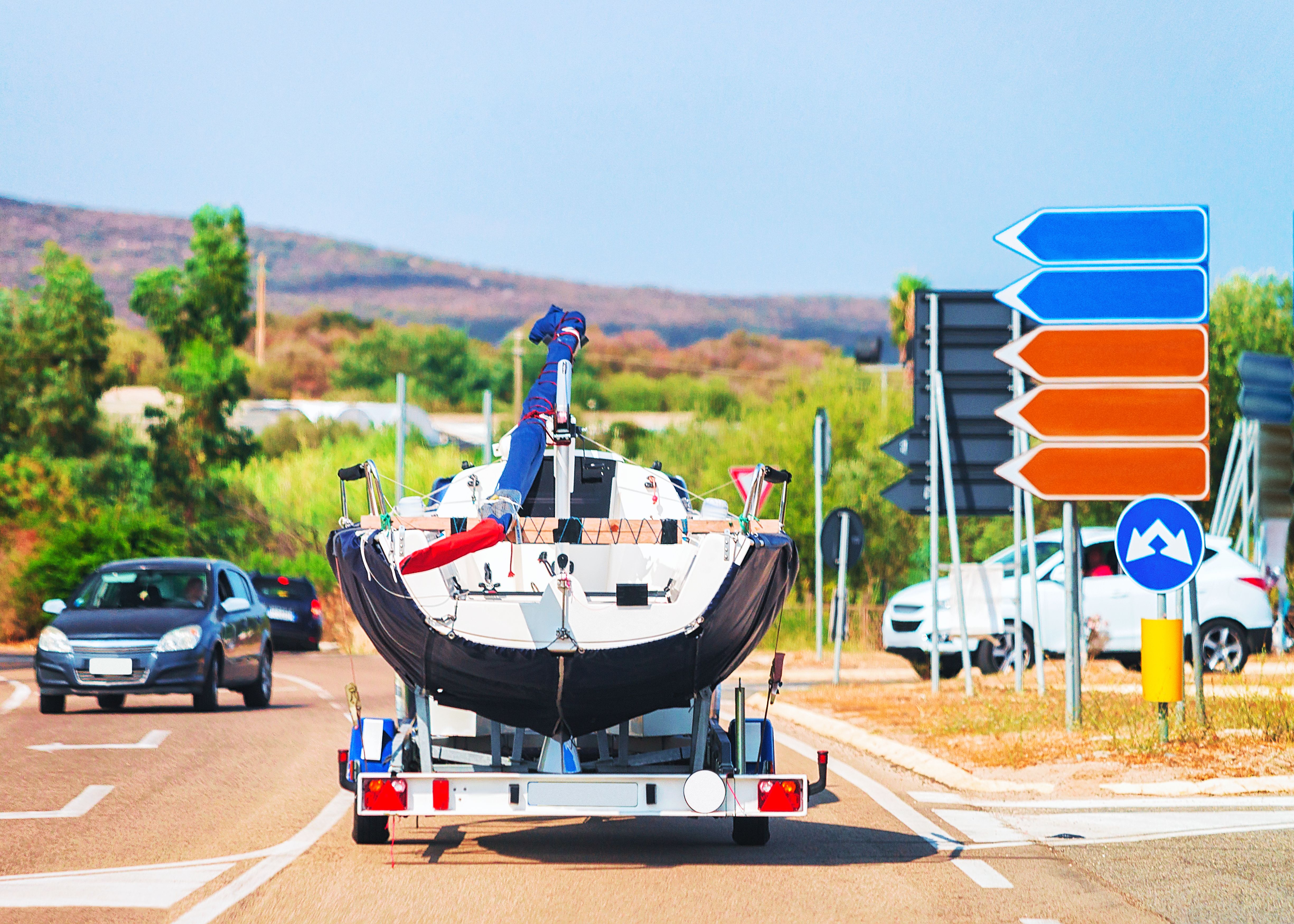 car with motor boat trailer road olbia costa smeralda sardinia italy